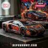 AC/DC branded Lamborghini Aventador LP700-4 model car in black with orange lightning graphics and bell artwork on table.!