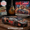AC/DC Lamborghini Aventador LP700-4 model car featuring black paint, lightning graphics, and red text on a wooden base.!