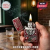 Alabama Crimson Tide Zippo lighter with embossed elephant, stadium, and football helmet graphics on a red metal finish.!