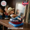 Alan Jackson bobblehead wearing a cowboy hat, sunglasses, and western boots, sitting in an Atlanta Braves inner tube.!