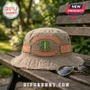 Tan cotton bucket hat with embroidered Alpha Kappa Alpha sorority crest, 1908 text, and AKA patches on a park bench.!