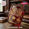 Deep red glass whiskey tumbler featuring gold embossed American eagle, Liberty Bell, and America 250 anniversary text.!