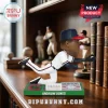 Andruw Jones baseball bobblehead wearing white uniform, red and blue cap, blowing bubble, standing on green stadium base.!