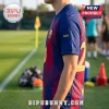 Man wearing navy and red FC Barcelona jersey with number 2 on the back and yellow AM initials on the sleeve.!