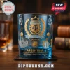 Blue glass whiskey tumbler featuring gold AFA Argentina World Cup Champions crest and soccer stadium graphics.!