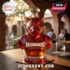 Faceted red glass razorback hog whiskey decanter with Razorbacks text and Woo Pig Sooie inscription on a wooden bar top.!
