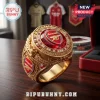 Gold Arsenal FC championship ring featuring a red gemstone center, team crests, and 2026 UEFA Champions League engraving.!