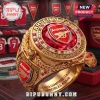 Gold Arsenal FC 2026 UEFA Champions League championship ring with a large red center stone and team crest detail.!