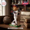 David Justice Atlanta Braves resin bobblehead standing on a green base with Truist branding and a vintage baseball nearby.!