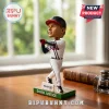 David Justice Atlanta Braves bobblehead standing on a green base with Truist logo in a home office setting.!