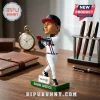 David Justice Atlanta Braves bobblehead figurine wearing white uniform with navy cap on a green base labeled Truist.!