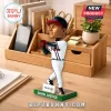 David Justice Atlanta Braves bobblehead in white uniform swinging a bat on a green base placed on a wooden desk organizer.!