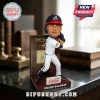 Drake Baldwin Atlanta Braves bobblehead standing on a branded base with a wood-grain plaque backdrop on a granite desk.!