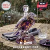 Purple and gold raven-shaped glass whiskey decanter with Purple Rising Baltimore Ravens etched on the crystal base.!