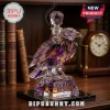 Purple and gold glass raven decanter engraved with Purple Rising and Baltimore Ravens Est. 1996 on a black base.!