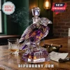 Crystal raven decanter with purple and gold accents labeled Purple Rising Est. 1996 Baltimore Ravens on a wooden table.!