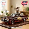 Batmobile whiskey decanter in amber glass with a metallic horse jockey topper on a dark wood display base.!