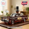 Amber glass Batmobile car decanter with Jack Daniel's bottle neck on a dark wooden base, featuring 60th anniversary badge.!