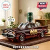 Amber-colored Batmobile decanter with Jameson bottle topper on a dark wooden base featuring a 60th anniversary gold emblem.!