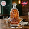 Custom sculpted glass decanter shaped like a woman's bust filled with amber liquid, labeled The Queen's Reserve.!