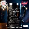Black metal beer stein with silver embossed Black Sabbath logo, winged demon figure, and 57th anniversary text on dark wood.!