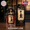 Blackheart Cursed Queen spiced rum bottle featuring a female pirate bust cap and ornate label on a wooden table.!