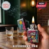 Chrome Zippo lighter with Blink-182 band graphics, smiley face, skateboard, and text held in hand with smoke and flame.!