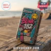Blink-182 Zippo lighter with colorful pop-punk stickers and beach graphics on a weathered wooden boardwalk.!