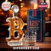 B-shaped glass whiskey bottle with baseball stopper, 125th anniversary Red Sox label, and crystal tumbler on table.!