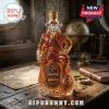 Captain Morgan shaped amber glass rum decanter on a wooden desk with a map, compass, and leather book background.!