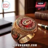 Carolina Hurricanes 2026 Stanley Cup gold championship ring with red center stone, black accents, and engraved lettering.!