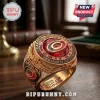 Carolina Hurricanes 2026 Stanley Cup gold championship ring with red center stone, team logo, and engraved lettering.!