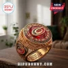 Carolina Hurricanes 2026 Stanley Cup gold championship ring with red center stone, text engravings, and white crystals.!