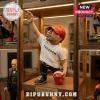 Resin collectible figurine of a man in a white Freedom t-shirt and red MAGA hat standing on a wooden display shelf.!