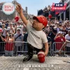 Bobblehead figurine wearing a red MAGA hat and white Freedom t-shirt, gesturing with an outstretched arm on a cobblestone.!