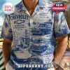 Blue and white Chevrolet themed short-sleeve button-up shirt featuring vintage car illustrations and road trip landmarks.!