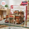 Chick-fil-A 80th anniversary building block set with restaurant facade, cow mascot figure, and dining area on glass table.!