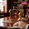 B-shaped glass whiskey decanter with black tiger stripes on a brown leather desk in a study.!