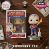 Claude Lemieux vinyl collectible figure in hockey jersey holding a torch with a silver trophy on a wooden table surface.!