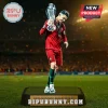 Cristiano Ronaldo in a red Portugal kit holding the UEFA Nations League trophy on a display stand with stadium background.!