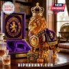 Amber glass lion figurine wearing a gold crown with purple cape, standing next to a purple velvet Crown Royal storage box.!