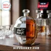 Daft Punk helmet-shaped whiskey decanter in silver and gold glass, sitting on a wooden surface with a crystal stopper.!