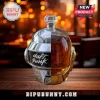 Daft Punk helmet shaped glass whiskey decanter with silver and gold metallic finish sitting on a wooden table.!