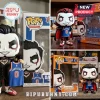Danhausen Funko Pop vinyl figures wearing New York Knicks basketball jerseys with display boxes on a wooden surface.!
