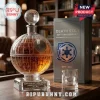 Spherical glass Death Star whiskey decanter with 50th-anniversary engraving on a crystal base next to matching box.!