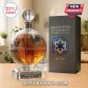 Death Star whiskey decanter with laser-etched surface, round stopper, and square crystal base on a wooden desk.!