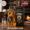 Scallywag blended malt Scotch whisky in a dog-shaped glass bottle with a monocle and matching black display box on a table.!