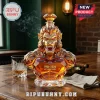 Amber glass decanter shaped like a monkey bust with a diamond-shaped stopper, labeled 1986-2026 40th anniversary.!