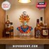 Dragon Ball Z Goku crystal decanter bust with 1986-2026 40th anniversary text, centered on a shelf with various liquor bottles.!