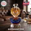 Majin Vegeta whiskey decanter made of faceted amber and blue glass with a crystal stopper on a wooden table.!